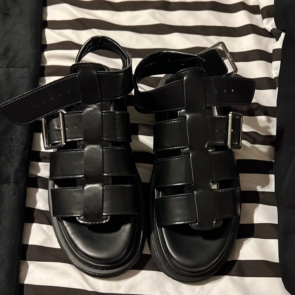 Chunky black sandals.